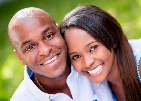 beautiful portrait of a happy couple smiling outdoors